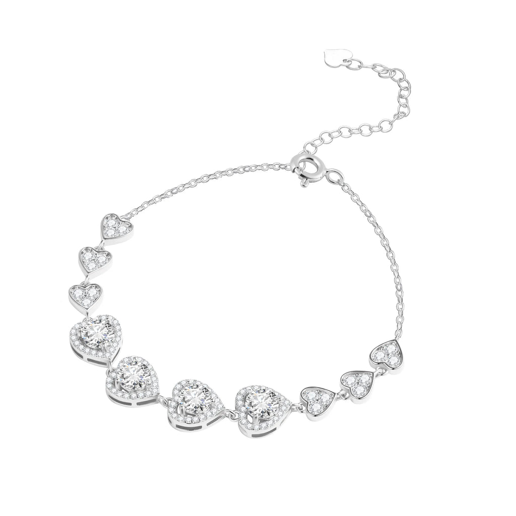 Silver heart link bracelet on white, with four larger center hearts and three smaller hearts on each side
