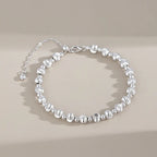 Silver round bead bracelet with brushed beads and polished spacers