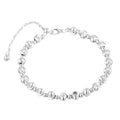 Silver round bead bracelet with alternating brushed beads and polished spacers on a white background