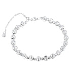 Silver round bead bracelet with alternating brushed beads and polished spacers on a white background
